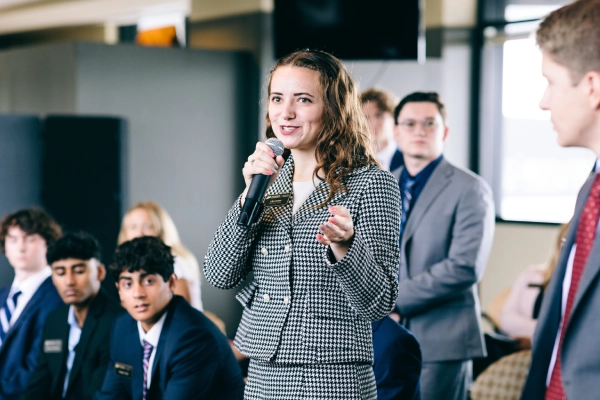 Student speaking with microphone