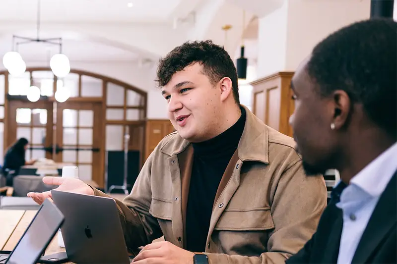 Candid photo of two masters students