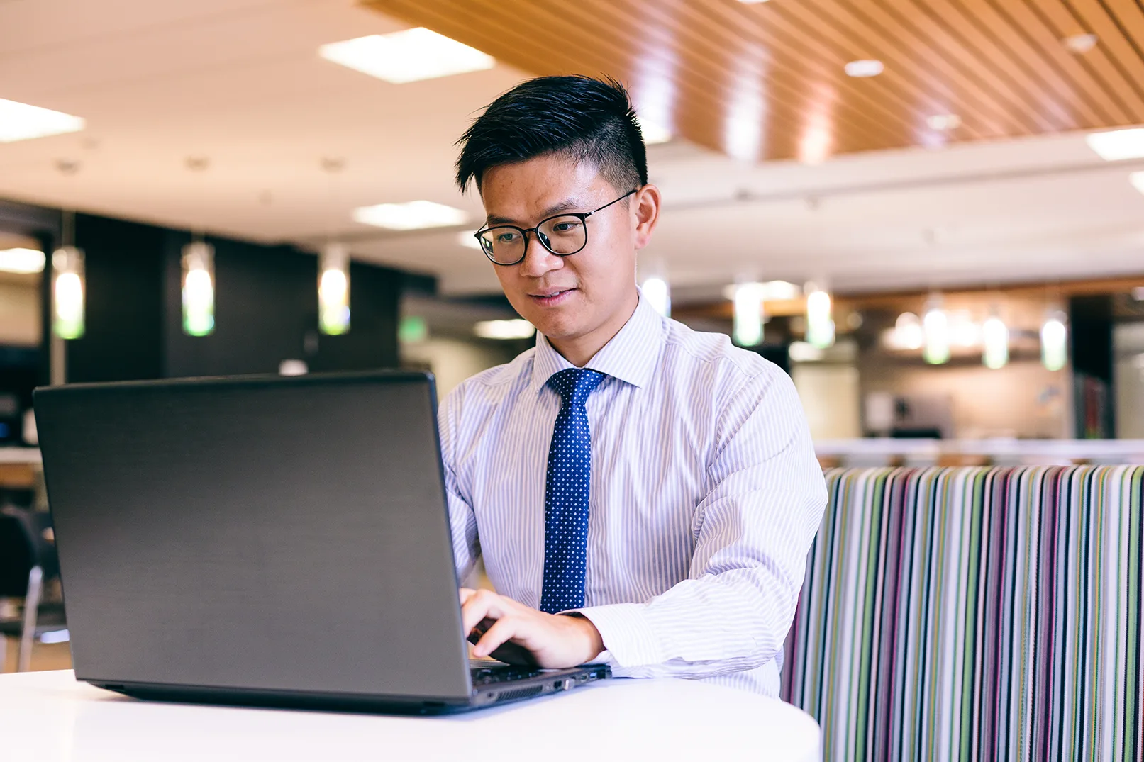 Graduate student using laptop