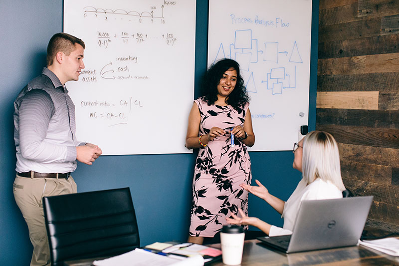 Shannon Hadley, Anushaa Nukala, and Trey Nelson working on a project