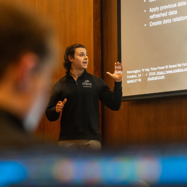 Larsen student giving workshop presentation