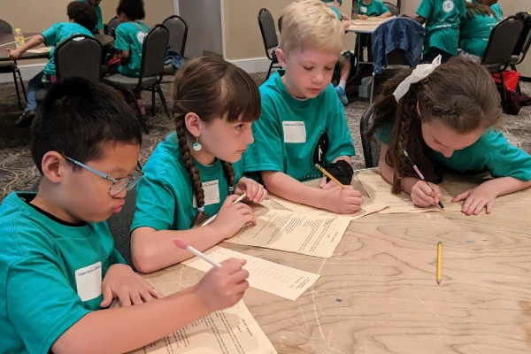 Group of students take a team test