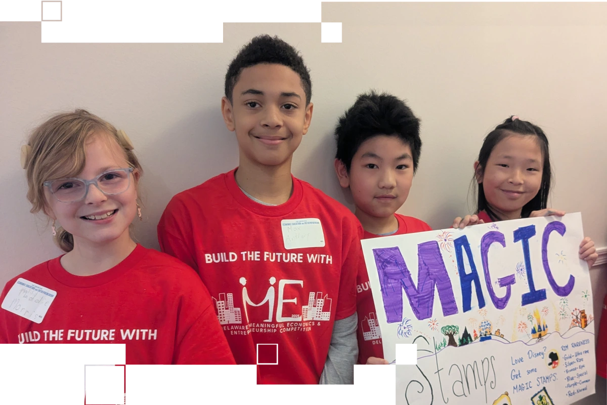 Students holding a project poster from ME competition