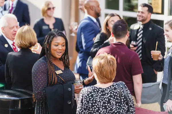 Two people talking outside