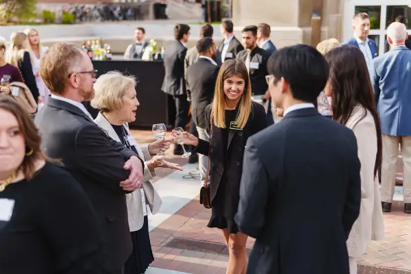 5 people conversing outside
