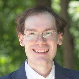 Headshot of Rhodes Pinto