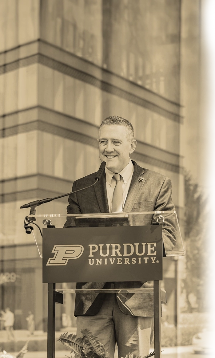 Stylized photo of Dean Bullard giving a speech