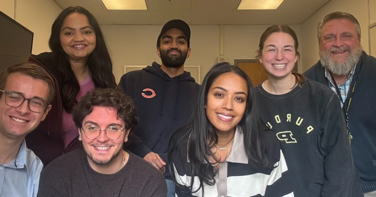 Malaika with her team smiling