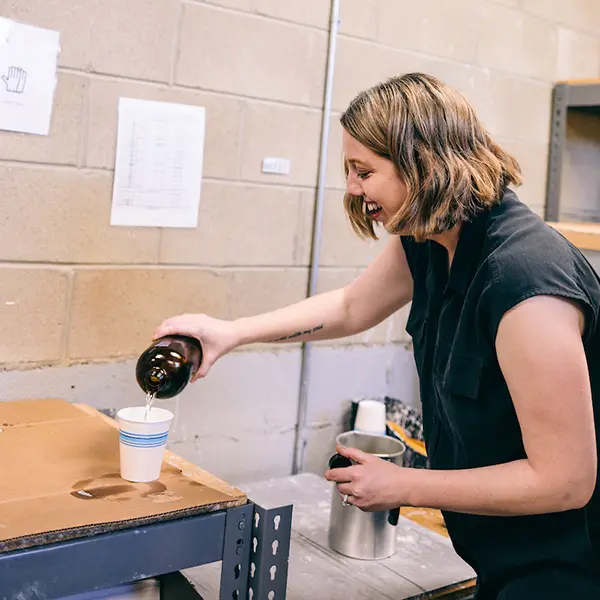 Brittany Whitenack making a candle