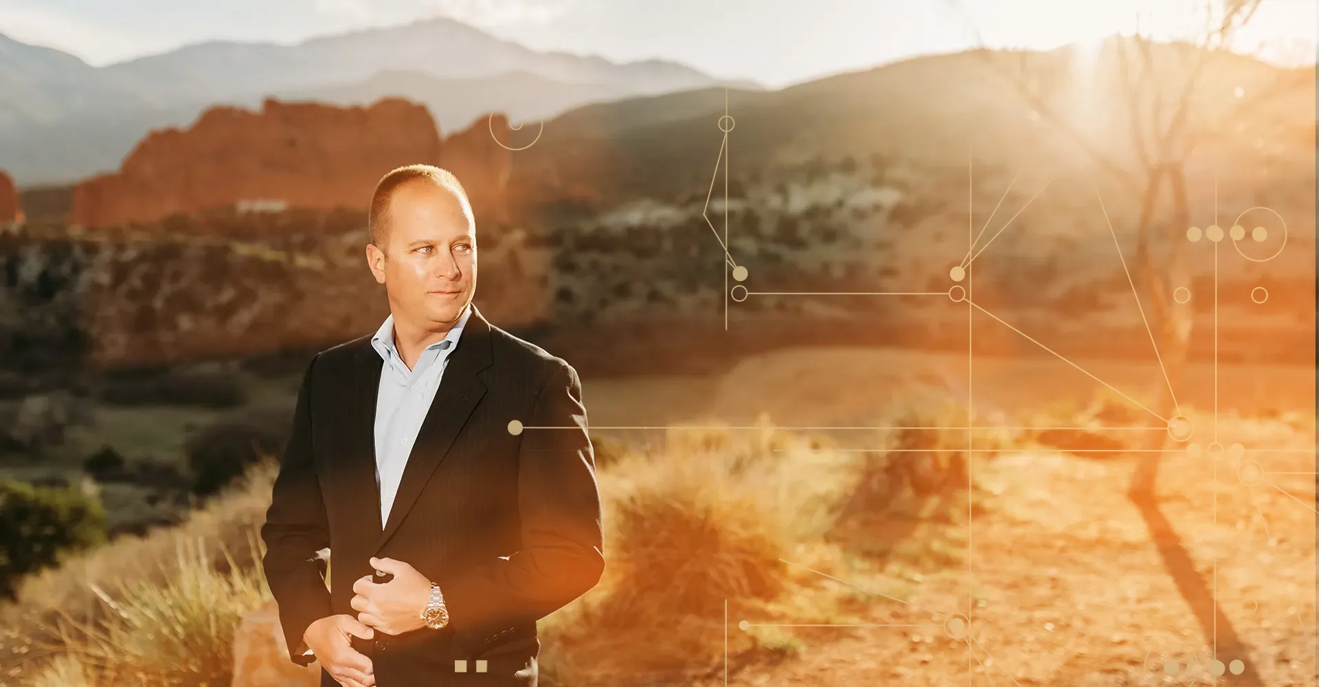 Adam Beal in front of an outdoor landscape