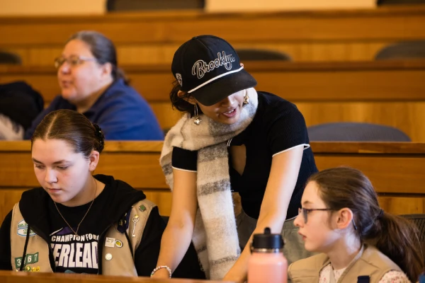 Student works with students at event