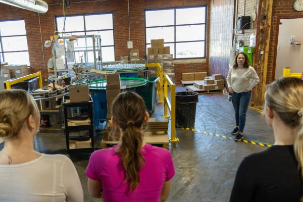 candles sorted by scent on a warehouse shelf