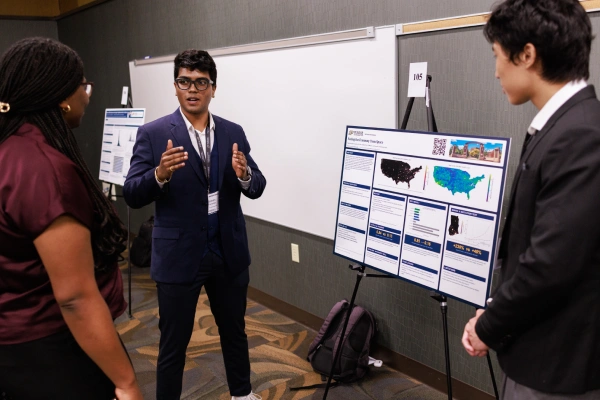 Rohan Fernando presents research poster