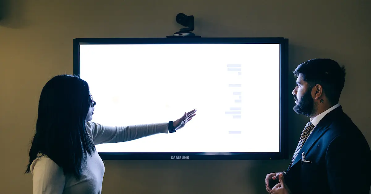 Two students look at a screen
