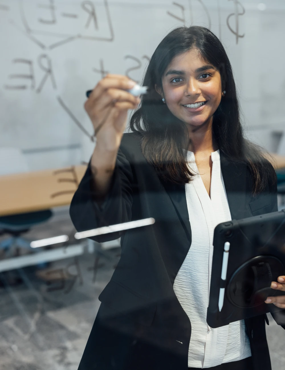 Business student writing on glass