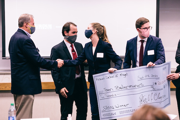 Students display their winning Case Competition